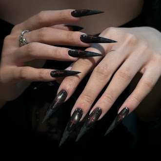 Glossy black dramatic nail design worn on hand